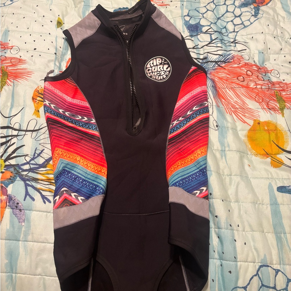 Rip Curl Black and Red Surf Wetsuit shorty.